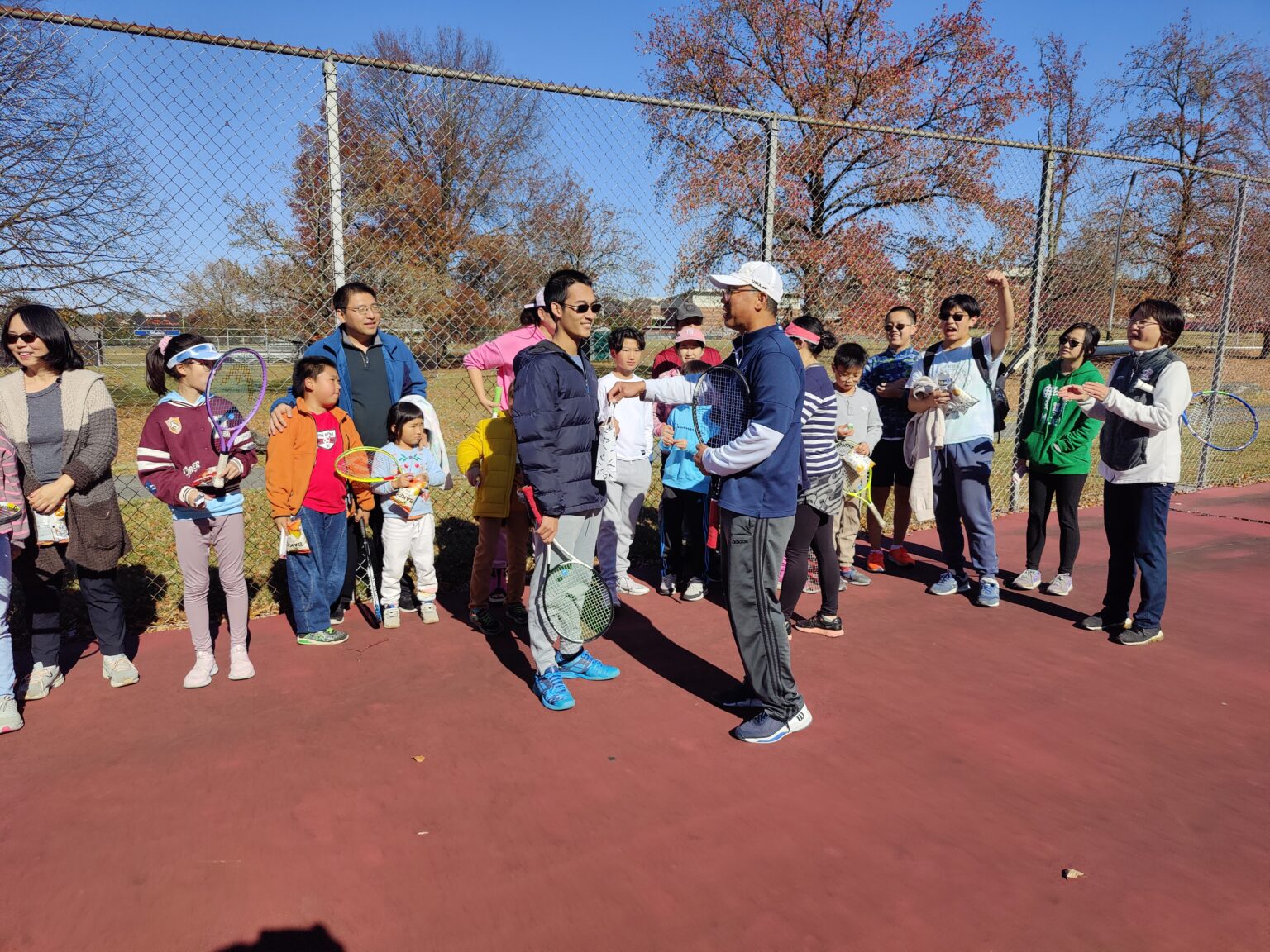Kevin Yao with players and families at the 2024 fall tennis club