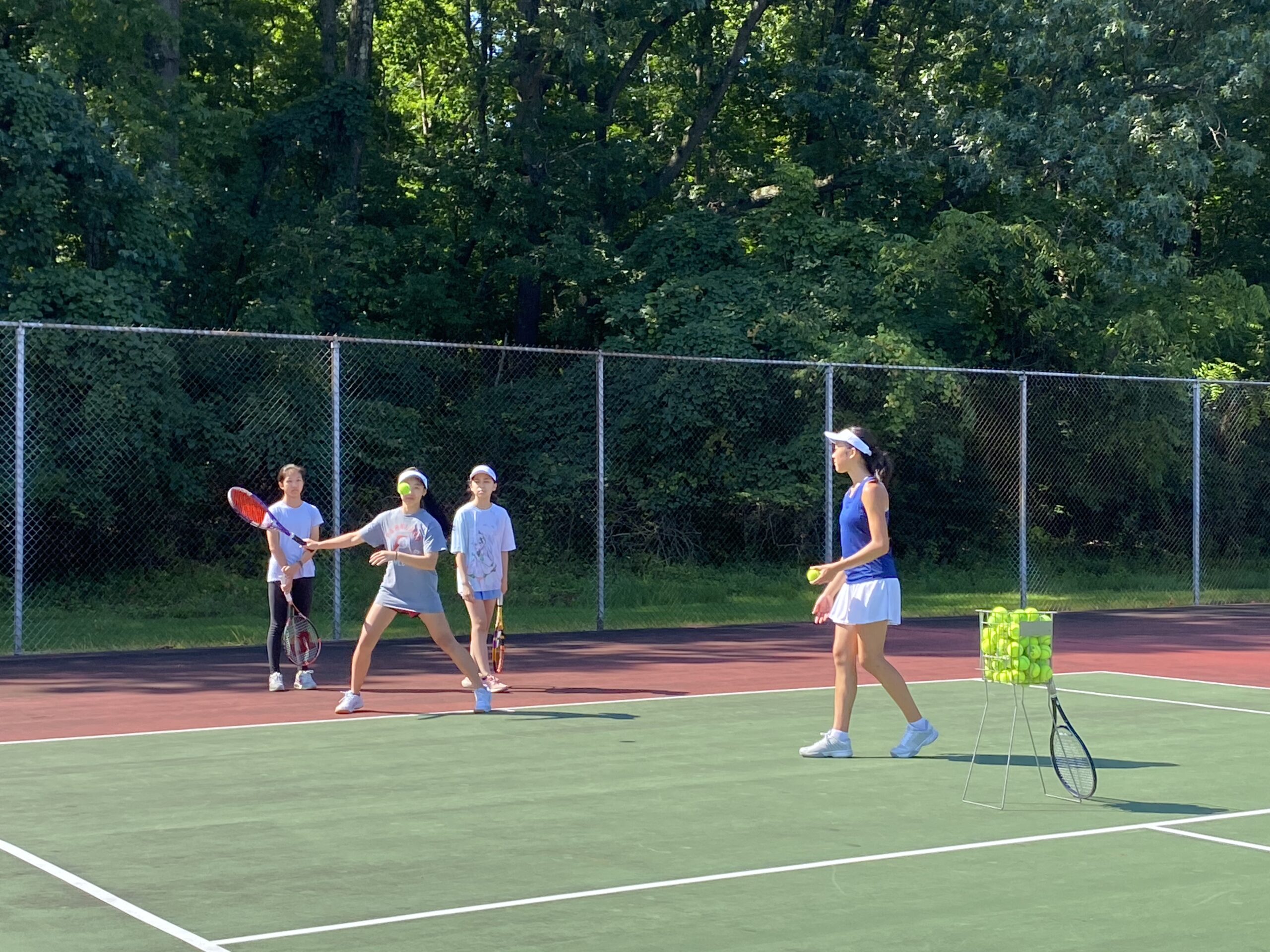 Young players working through a 2023 fall tennis exercise