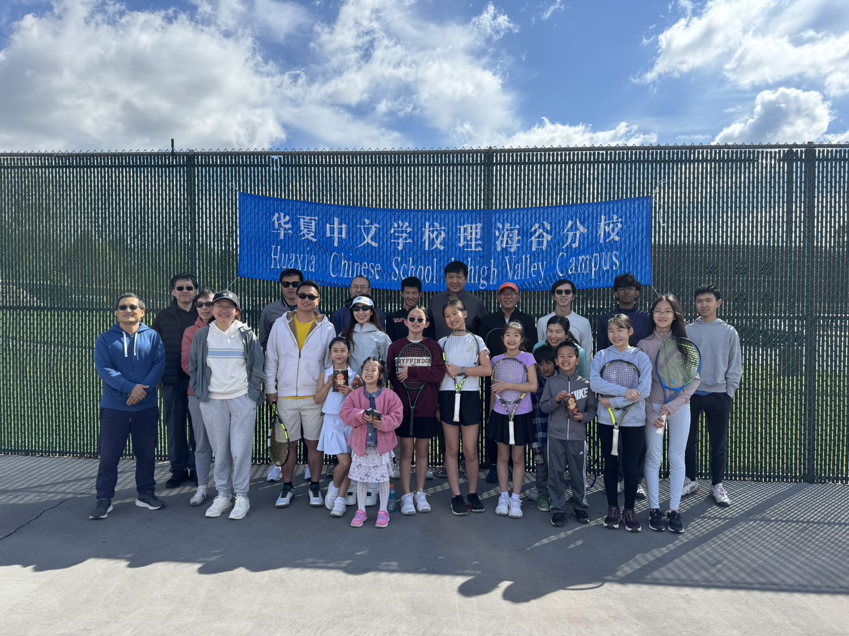 HXCS-LV Tennis Club players and families gathered on the court
