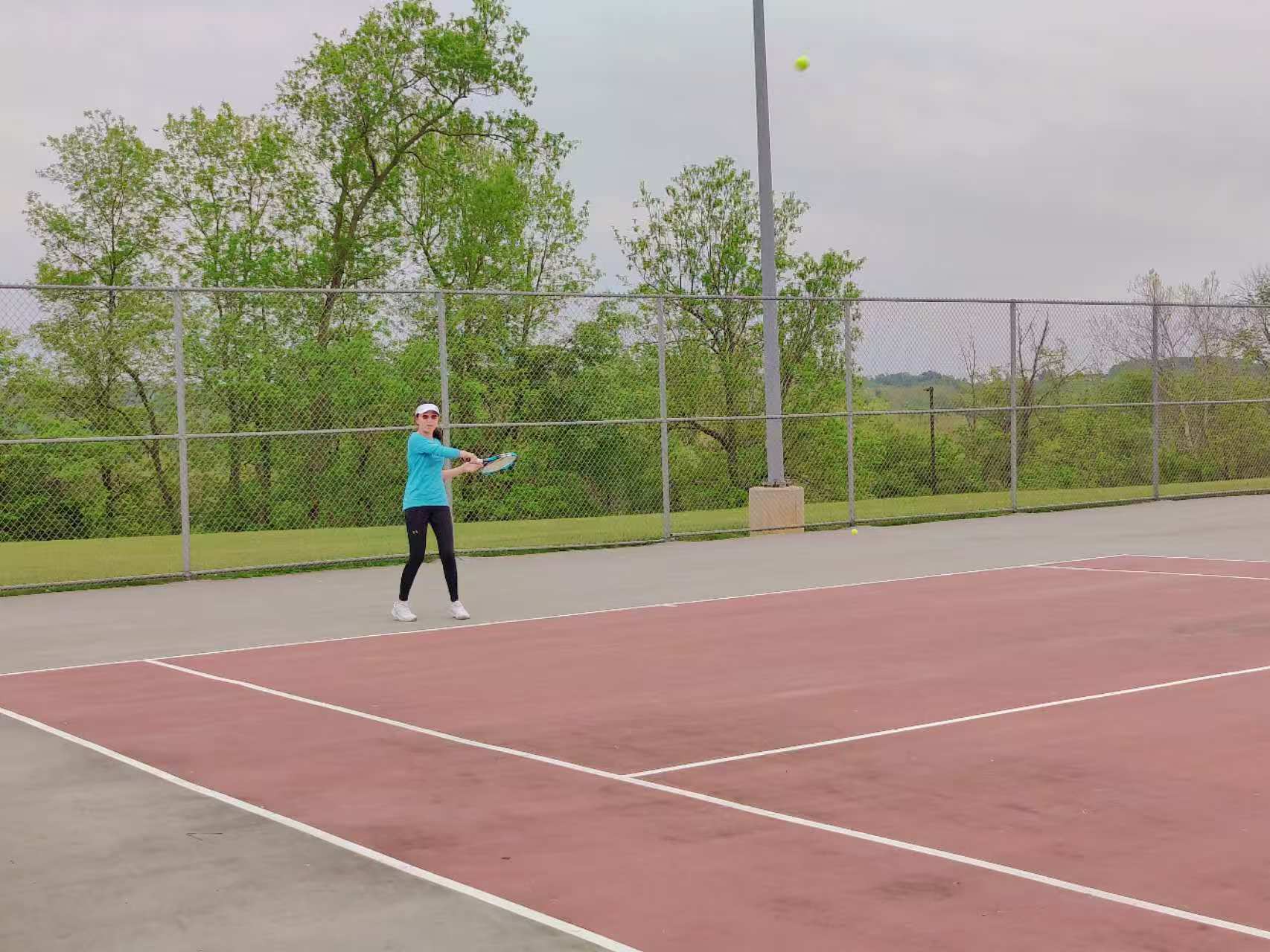 A player returning a ball during the 2023 spring tennis ladder