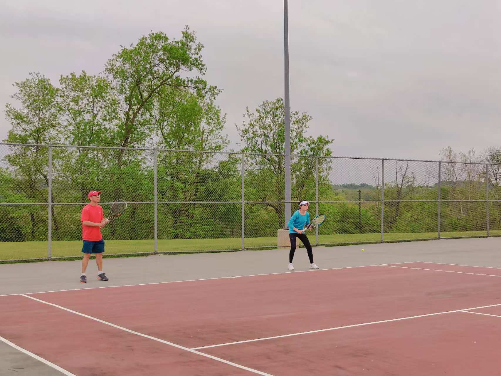 Players competing in a 2023 spring tennis ladder match