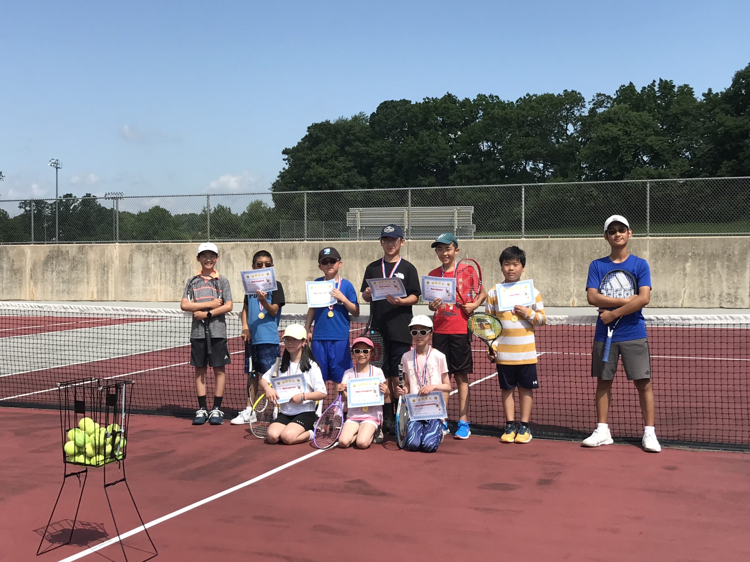 2022 summer camp participants holding certificates together